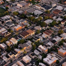 view of a town from above showing streets lined with buildings