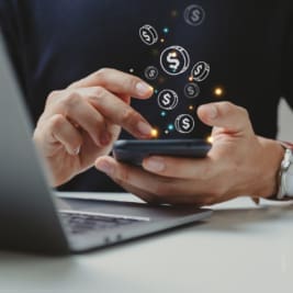 Hand of businessman using smart phone with coin icon,